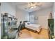 Bedroom with hardwood floors, ceiling fan, and a large desk at 4532 Shark Dr, Bradenton, FL 34208