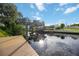 Scenic canal view from a private dock, reflecting the sky and surrounding trees at 4532 Shark Dr, Bradenton, FL 34208