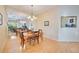Bright dining room featuring hardwood floors, and mirrored wall reflecting the room at 4532 Shark Dr, Bradenton, FL 34208