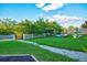 Community kayak launch area with grassy lawn, boat storage, and water access at 4532 Shark Dr, Bradenton, FL 34208