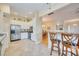 Open kitchen with bar seating, stainless steel appliances, and tile flooring at 4532 Shark Dr, Bradenton, FL 34208