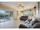 Spacious living room with sliding glass doors leading to pool area at 4532 Shark Dr, Bradenton, FL 34208