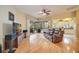 Comfortable living room with hardwood floors, a leather sofa, and access to screened patio at 4532 Shark Dr, Bradenton, FL 34208