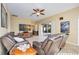 Living room with leather seating, ceiling fan, and sliding glass doors at 4532 Shark Dr, Bradenton, FL 34208
