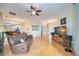 Inviting living room with natural light, hardwood floors, and comfortable seating, perfect for relaxation and entertaining at 4532 Shark Dr, Bradenton, FL 34208