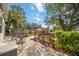 Water view from a brick patio with outdoor furniture and tropical landscaping at 4532 Shark Dr, Bradenton, FL 34208