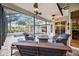 Relaxing screened-in patio with comfortable seating surrounding a sparkling pool and spa at 4532 Shark Dr, Bradenton, FL 34208