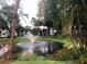 Landscaped pond with fountain in community at 3271 Beneva Rd # 204, Sarasota, FL 34232