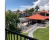 Community pool with pergola and lounge area at 3271 Beneva Rd # 204, Sarasota, FL 34232