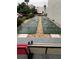 Community shuffleboard court with benches at 3271 Beneva Rd # 204, Sarasota, FL 34232