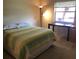 Bedroom with a double bed, desk, and window at 3271 Beneva Rd # 204, Sarasota, FL 34232