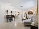 Bright living room with light walls, comfy seating, and a unique side table at 302 Mendez Dr, Sarasota, FL 34243