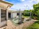 Inviting patio with seating area and lush landscaping at 302 Mendez Dr, Sarasota, FL 34243