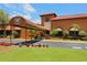 Attractive community clubhouse with covered entryway at 302 Mendez Dr, Sarasota, FL 34243