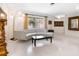 Living room with curved sofa and terrazzo flooring at 302 Mendez Dr, Sarasota, FL 34243