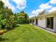 Large grassy backyard, providing a tranquil outdoor space at 302 Mendez Dr, Sarasota, FL 34243