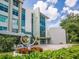 Modern community entrance with landscaping and art at 302 Mendez Dr, Sarasota, FL 34243