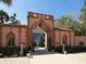 Ornate entrance to the Ringling Museum, featuring arched gateways and sculpted lions at 302 Mendez Dr, Sarasota, FL 34243