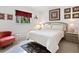 Charming bedroom with a queen-size bed and red accents at 302 Mendez Dr, Sarasota, FL 34243
