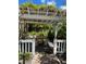 Relaxing patio area with seating and lush landscaping at 1603 Gulf N Dr # 5, Bradenton Beach, FL 34217