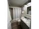 Updated bathroom with granite vanity and tub shower combo at 1603 Gulf N Dr # 5, Bradenton Beach, FL 34217