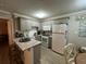 Well-equipped kitchen with granite countertops and light wood cabinets at 1603 Gulf N Dr # 5, Bradenton Beach, FL 34217