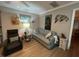 Cozy living room featuring a comfortable sofa and relaxing armchair at 1603 Gulf N Dr # 5, Bradenton Beach, FL 34217