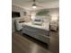 King size bed, dresser and beach themed decor in bedroom at 1603 Gulf N Dr # 5, Bradenton Beach, FL 34217