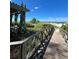 Wooden walkway provides access to the beach, passing a shaded gazebo at 1603 Gulf N Dr # 5, Bradenton Beach, FL 34217