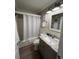 Updated bathroom with granite vanity and tub shower combo at 1603 Gulf N Dr # 5, Bradenton Beach, FL 34217