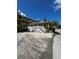 Front view of a yellow cottage with white porch at 1603 Gulf N Dr # 5, Bradenton Beach, FL 34217