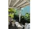 Covered patio with stone table and bench seating at 1603 Gulf N Dr # 5, Bradenton Beach, FL 34217