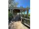 Wooden gazebo with seating provides shade and a place to relax by the beach at 1603 Gulf N Dr # 5, Bradenton Beach, FL 34217