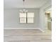 Bright dining room features wood-look floors and a chandelier at 515 30Th W Ave # H201, Bradenton, FL 34205