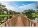 Wooden dock extending over the lake at 515 30Th W Ave # H201, Bradenton, FL 34205