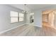 Spacious dining area with wood-look floors, kitchen view at 515 30Th W Ave # H201, Bradenton, FL 34205