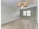 Bright bedroom with wood-look flooring and ceiling fan at 515 30Th W Ave # H201, Bradenton, FL 34205