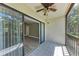 Bright screened balcony with sliding doors leading to the living area at 515 30Th W Ave # H201, Bradenton, FL 34205