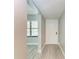 Bright condo entryway with white door and wood-look floors at 515 30Th W Ave # H201, Bradenton, FL 34205