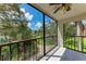 Spacious screened balcony overlooks lush landscaping and a tranquil pond at 515 30Th W Ave # H201, Bradenton, FL 34205