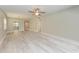 Large living room with ceiling fan and wood-look floors at 515 30Th W Ave # H201, Bradenton, FL 34205