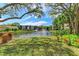 Scenic pond view with lush greenery and fountain at 515 30Th W Ave # H201, Bradenton, FL 34205