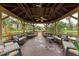 Relaxing gazebo with seating overlooking a pond at 515 30Th W Ave # H201, Bradenton, FL 34205