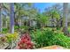Serene pond with a water fountain and lush landscaping at 515 30Th W Ave # H201, Bradenton, FL 34205