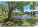 Peaceful pond with a bench and landscaping at 515 30Th W Ave # H201, Bradenton, FL 34205