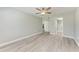 Bedroom with wood-look floors and access to bathroom at 515 30Th W Ave # H201, Bradenton, FL 34205