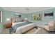 Comfortable bedroom featuring a large window and neutral furniture and cool wall colors at 5310 N Tuttle Ave, Sarasota, FL 34234