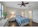 Guest bedroom with a queen bed and built-in shelving at 224 Babbling Brook Run, Bradenton, FL 34212