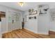 Spacious entryway with light gray walls and hardwood floors at 891 Faulkwood Ct, Sarasota, FL 34232