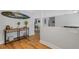 Bright and airy entryway with hardwood floors and a console table at 891 Faulkwood Ct, Sarasota, FL 34232